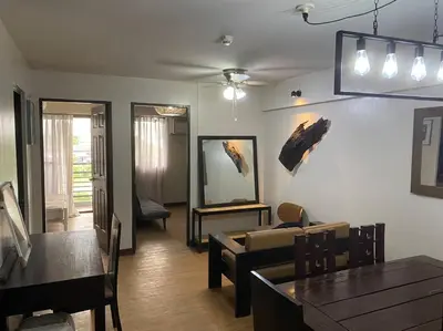 a living room with a couch and a table at Relax@Samaya Pasig in Manila