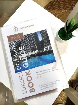 a magazine on a table with a plant at Shell res nr MOA 2BR free parking in Manila