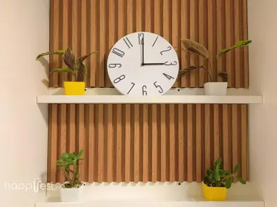 a clock on a wall with two potted plants at Happirest at Coast Residences, Pasay - 1 Bedroom with Balcony in Manila