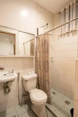 a bathroom with a toilet and a sink at JP Santiago Studio Makati J304 in Manila