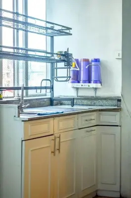a kitchen with a sink and a window at JP Santiago Studio Makati J307 in Manila