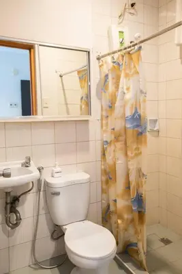 a bathroom with a toilet and a sink at JP Santiago Studio Makati J307 in Manila