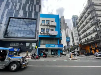 a truck driving down a street in a city at JP Santiago Studio Makati J307 in Manila