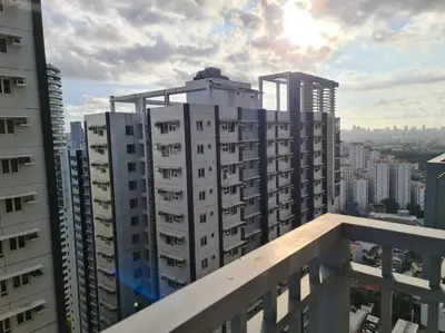 a view of buildings from a balcony in a city at Chic 2 Bedroom EDSA APT with Balcony in Manila