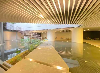 a large building with a large lobby with a large ceiling at AIR Luxury Makati CBD with balcony in Manila