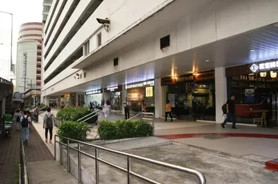 a large building with people walking in front of it at The Beacon Makati by mvmtransient in Manila