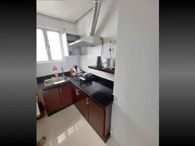a kitchen with a sink and a counter top at 40 Percent Promo Off This Month, Balcony Ocean View Plus Free Pool & Sauna Access Exclusive 2025 Rates at Walking Distance US Embassy, Front of Robinsons Place MANILA, Bellagio and Experience Breathtaking Manila Bay Views in Manila