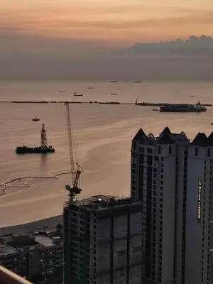 a view of the ocean from a skyscraper at Family Room Staycation In The Heart Of Manila, with 2 Balcony Plus 40 Percent Promo Discount Plus Free Pool Access, Plus Free Sauna Promo in Manila Bay, Robinsons Place, Ermita, Pgh, Bellagio, UP Pedrogil, Staycation Updated 2025 Price in Manila