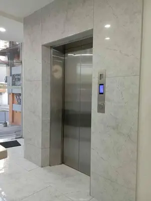 a elevator in a building with a sign on it at St. Marvin Studio Makati M308 in Manila