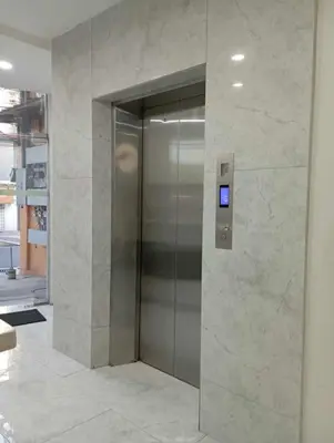 a elevator in a building with a sign on it at St. Marvin Studio Makati M304 in Manila