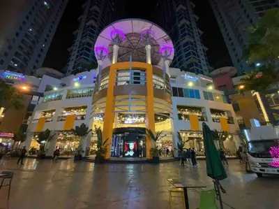 a large building in a city at night at Awesome Eastwood Condo Suite! in Manila
