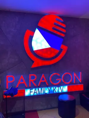 a neon sign for a paragon family kx at Elegant 2BR, 2 BA Suite Beside Eastwood Mall in Manila