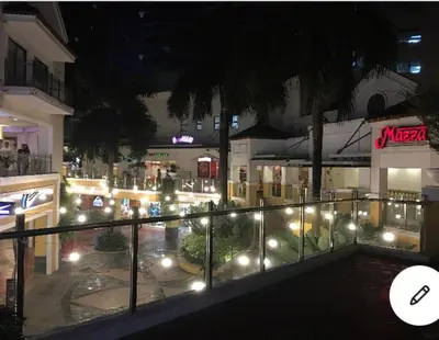 a view of a city at night with lights at Elegant 2BR, 2 BA Suite Beside Eastwood Mall in Manila