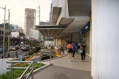 a group of people walking outside of a building at The Beacon Makati by mvmtransient in Manila