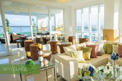 a living room with a couch and a table at Anuva Residence Condominium in Manila
