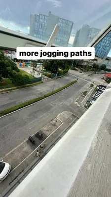 a view of a parking lot with the words more logging paths at Neat Unit in Holland Park Southwoods in Biñan