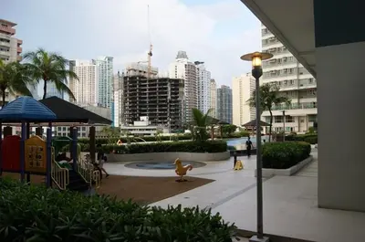 a playground with a duck in a city with buildings at The Beacon Makati by mvmtransient in Manila
