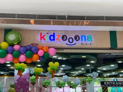 a sign in a store with balloons hanging from the ceiling at Morgan Suites Executive Residences in Manila
