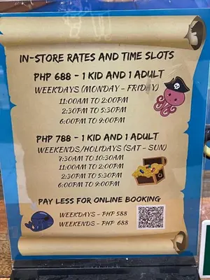 a sign for a store rates and time slots at Morgan Suites Executive Residences in Manila