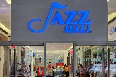 a mall with a sign on the front of it at Condo with Balcony at Makati SM Jazz in Manila