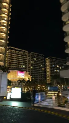 a view of a city at night with buildings at Azure Urban Beach Resort Residences in Manila