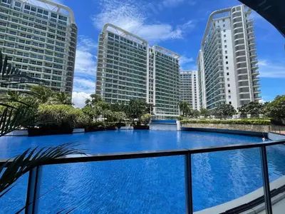 a view from the balcony of a hotel with tall buildings at Azure Urban Beach Resort Residences in Manila