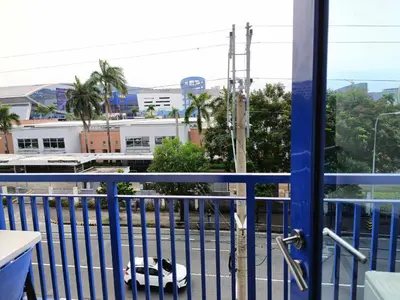 a view from a balcony with a car on the street at Sea Residence Finest in Manila