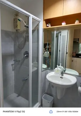 a bathroom with a shower and a sink at Sea Residence Finest in Manila
