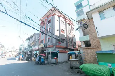 a street in an asian city with buildings at MCP Transient near NAIA in Manila