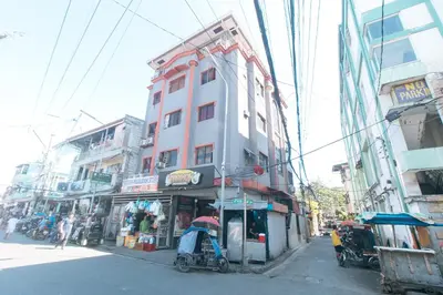 a building on the side of a city street at MCP Transient near NAIA in Manila