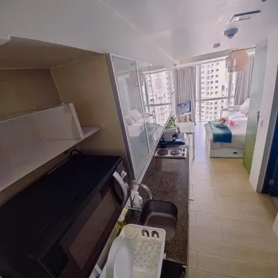 a small room with a view of a apartment at -CONDO- Petite Residential Stay in Manila