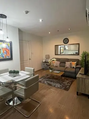 a living room with a couch and a table at Homestead in Manila