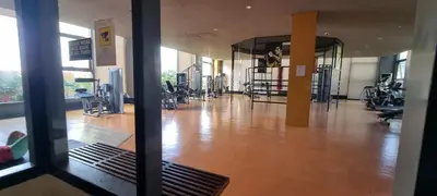 a view of a gym with a large room with exercise equipment at Bliss by Zen Residences at The Radiance Manila Bay in Manila