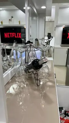 a group of wine glasses sitting on a counter at Cozy Condo near Mall of Asia in Manila
