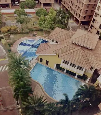 an overhead view of a swimming pool in a building at Cozy Studio Unit near Manila Airport With Swimming Pool, Full Kitchen 7A in Manila
