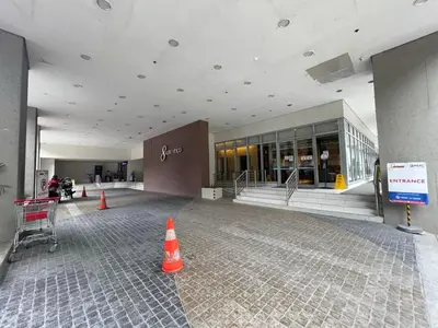a large building with orange cones in front of it at 8 Adriatico Staycation in Manila