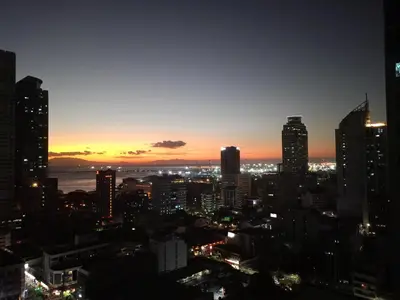 a view of a city skyline at night at 8 Adriatico Staycation in Manila