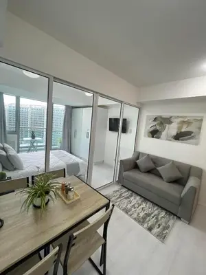 a living room with a couch and a table at Azure Urban Resort Residences in Manila