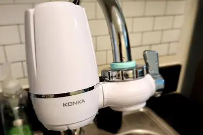 a white mixer sitting next to a sink at Chill Apartment in Makati in Manila