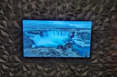 a picture of a waterfall on a wall at Chill Apartment in Makati in Manila