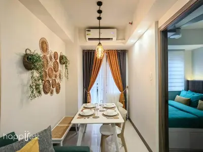 a small room with a table and a couch at Happirest at S Residences w/Balcony, Mall of Asia in Manila