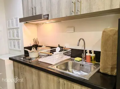 a kitchen with a sink and a counter top at Happirest at S Residences w/Balcony, Mall of Asia in Manila
