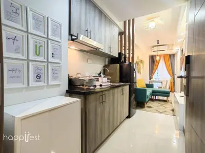 a kitchen with a refrigerator and a counter top at Happirest at S Residences w/Balcony, Mall of Asia in Manila