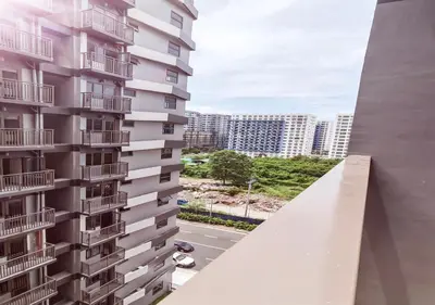 a view from the balcony of a tall building at S Residences1 bedroom with balcony near MOA in Manila