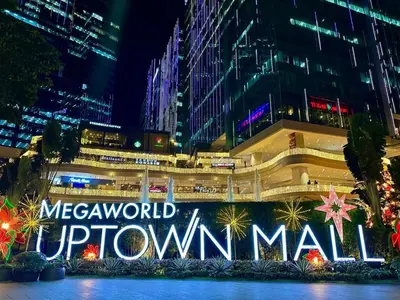 a building with a sign that reads mexatown downtown mall at Modern Suite In Bonifacio Global City in Manila