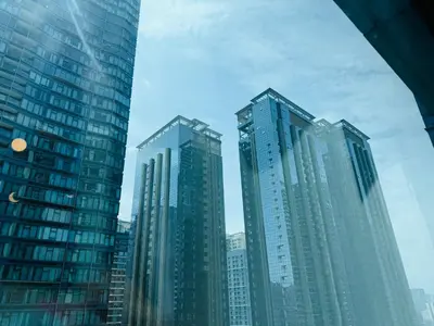 a group of tall buildings in a city at Modern Suite In Bonifacio Global City in Manila