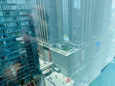 an aerial view of a city with tall buildings at Modern Suite In Bonifacio Global City in Manila