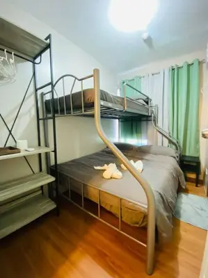 a bedroom with two bunk beds in a room at Cozy 2BR w/ Free Pool Access and Free Parking N224 in Manila