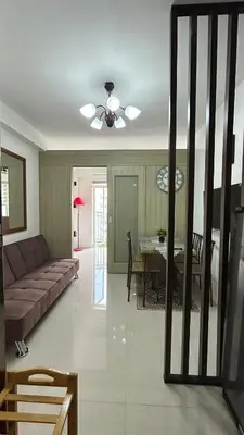 a living room with a couch and a table at Shore Residences in Manila