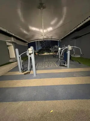 a gym with several treadmills and machines at Cairong Inn Condominium TV with Netflix FAME RESIDENCES in Manila
